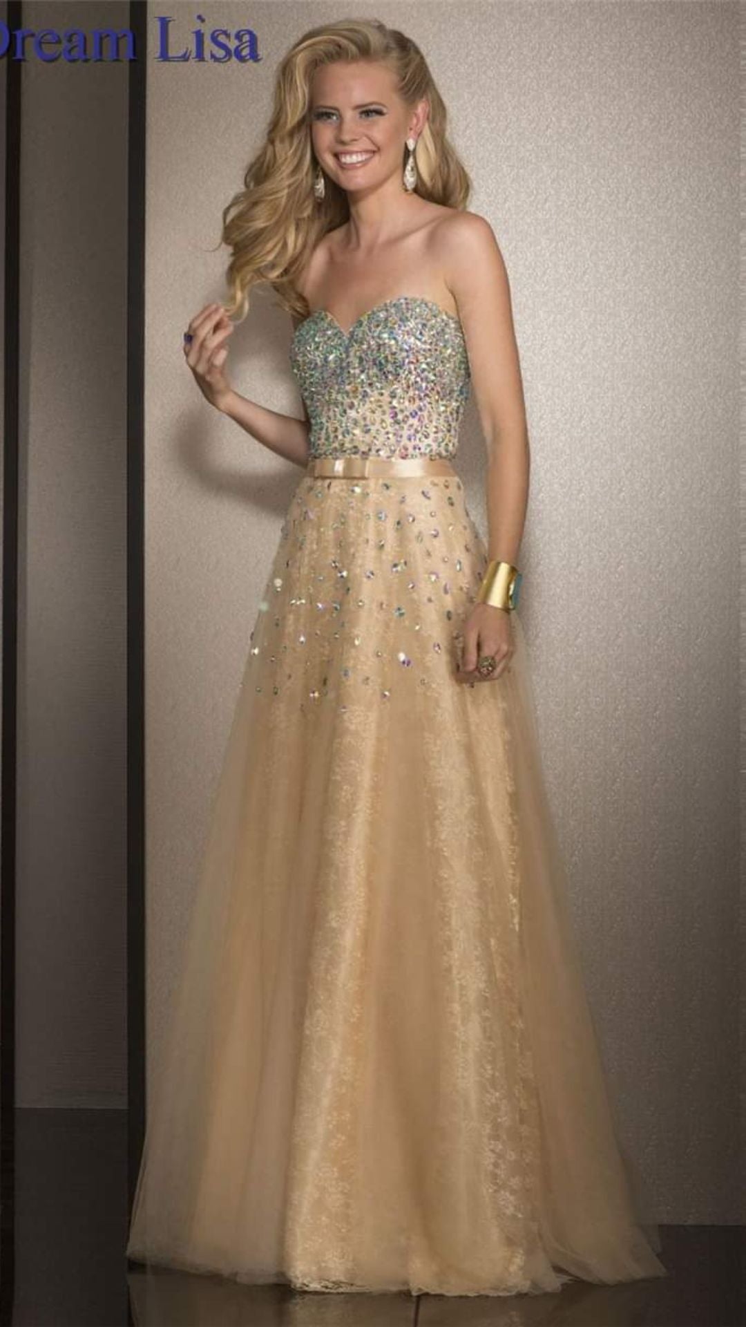 Cream strapless evening dress decorated with sequins and a luxurious bow.