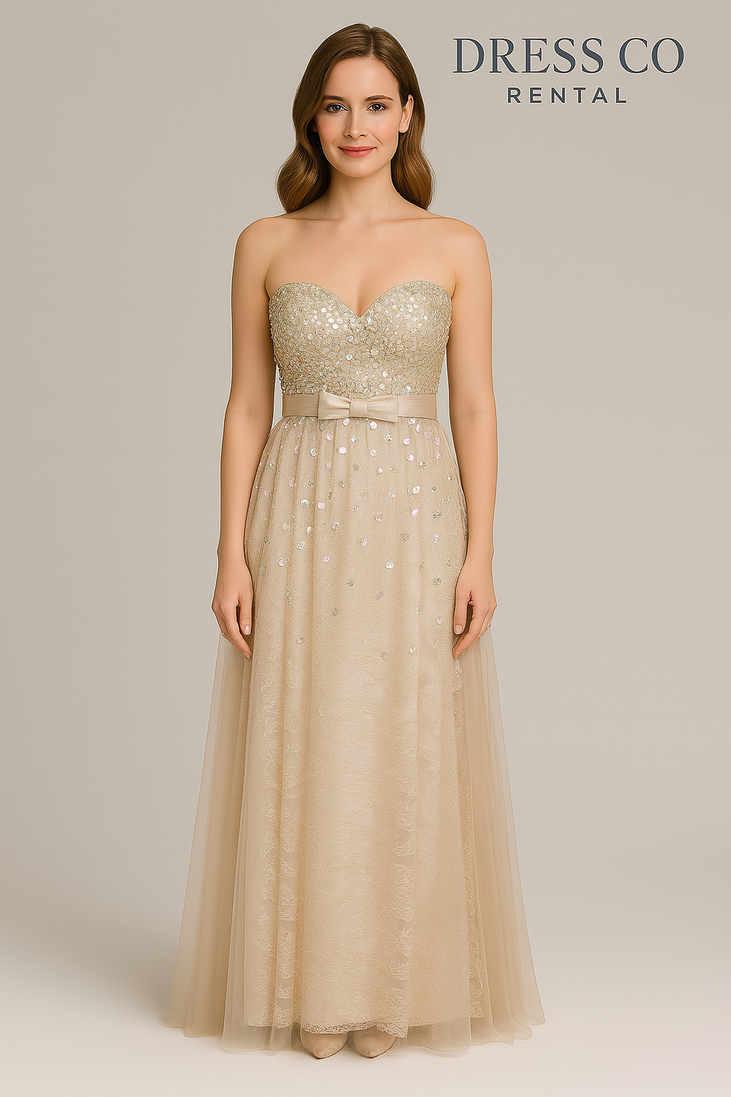 Cream strapless evening dress decorated with sequins and a luxurious bow.